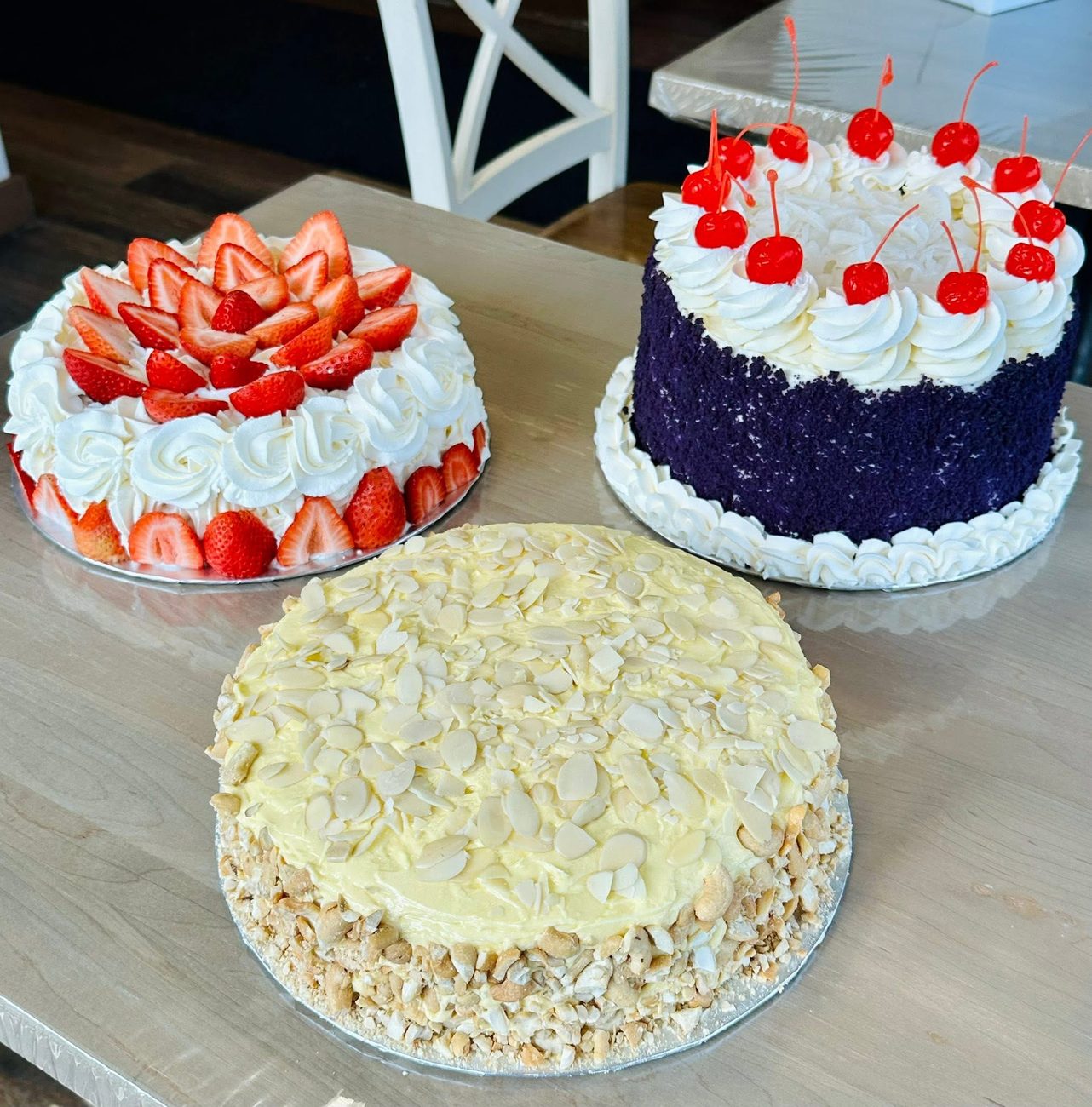 Trio of Cristina's cakes: strawberry shortcake, ube and sans rival